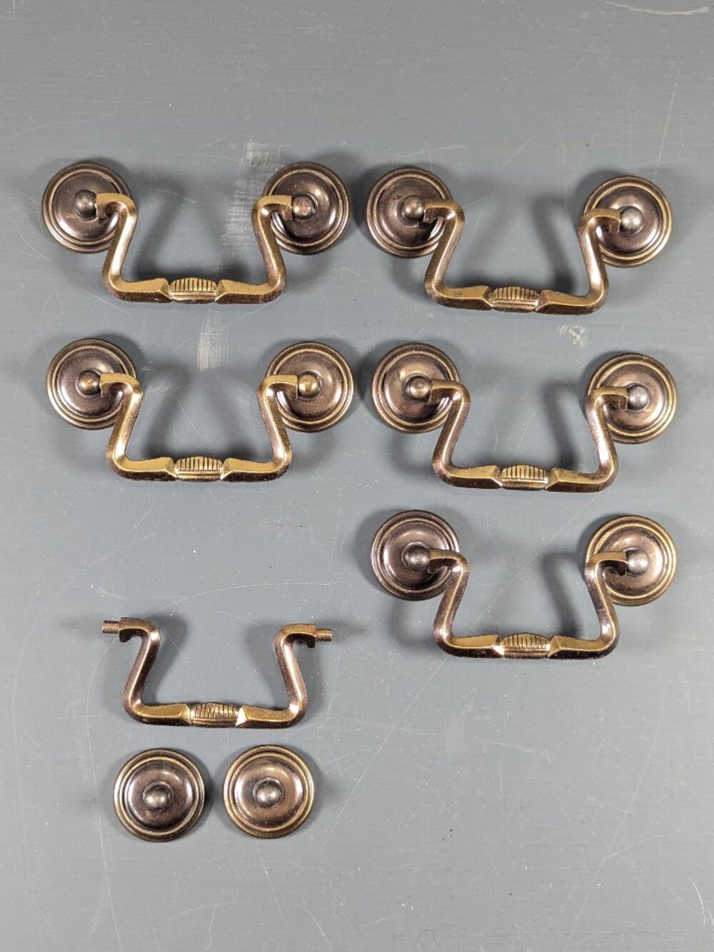 Set of 6 brass toned metal drawer pulls, drop pulls